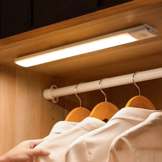 LED light bar mounted under wooden cabinet shelf
