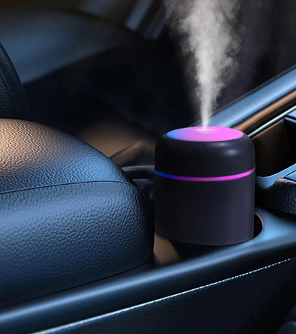 Mini humidifier in car cup holder with mist