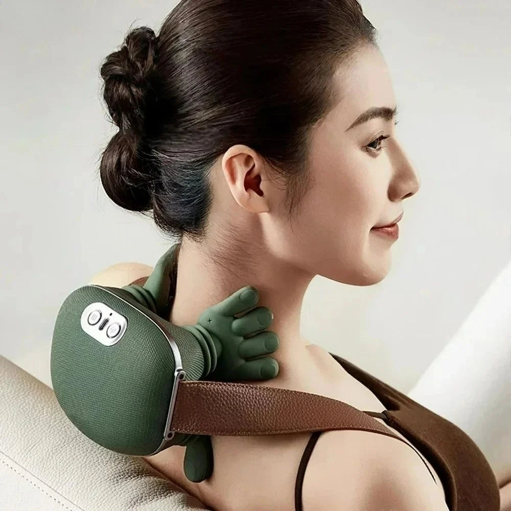 Woman wearing neck massager on shoulder