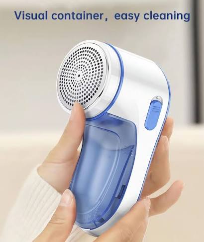 Electric lint remover purple transparent body used on sofa fabric